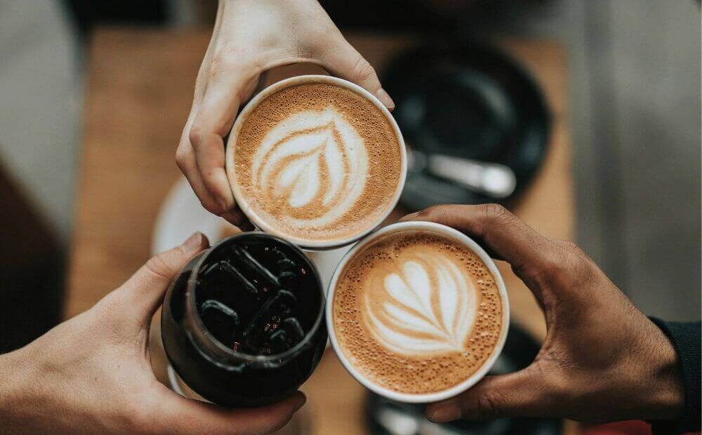 Three people drinking coffee