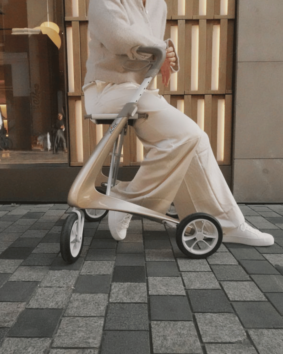 Elderly customer sitting on modern designed rollator from byACRE