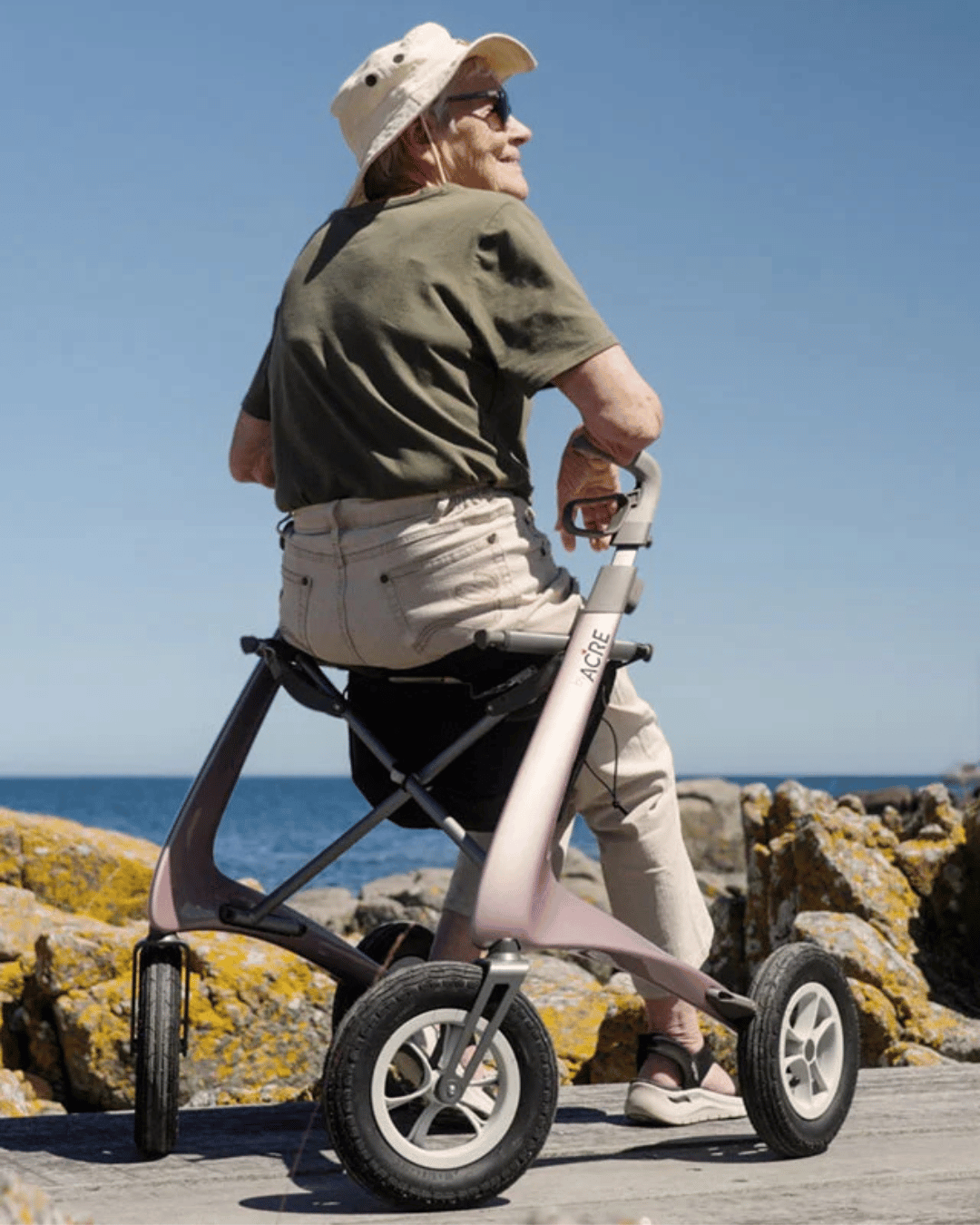 Outside location and photo of woman sitting on mobility aid