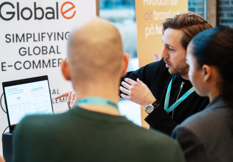 Global-e representative with event visitors