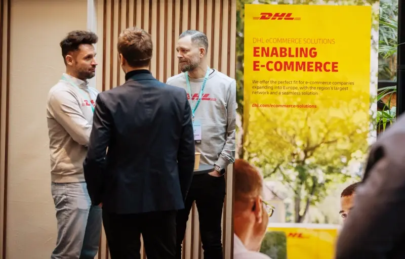 DHL representatives meeting with event guests